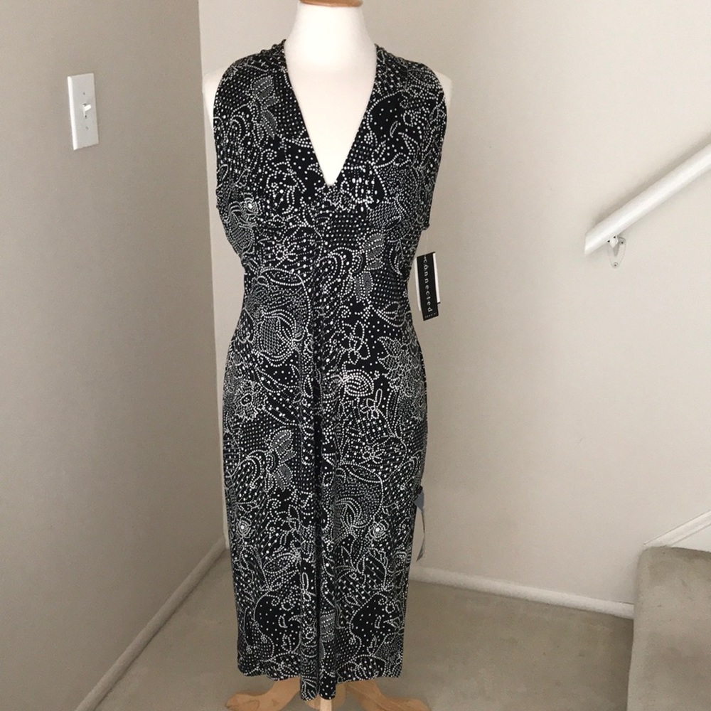 Dress. Excellent condition. Never worn. 16.